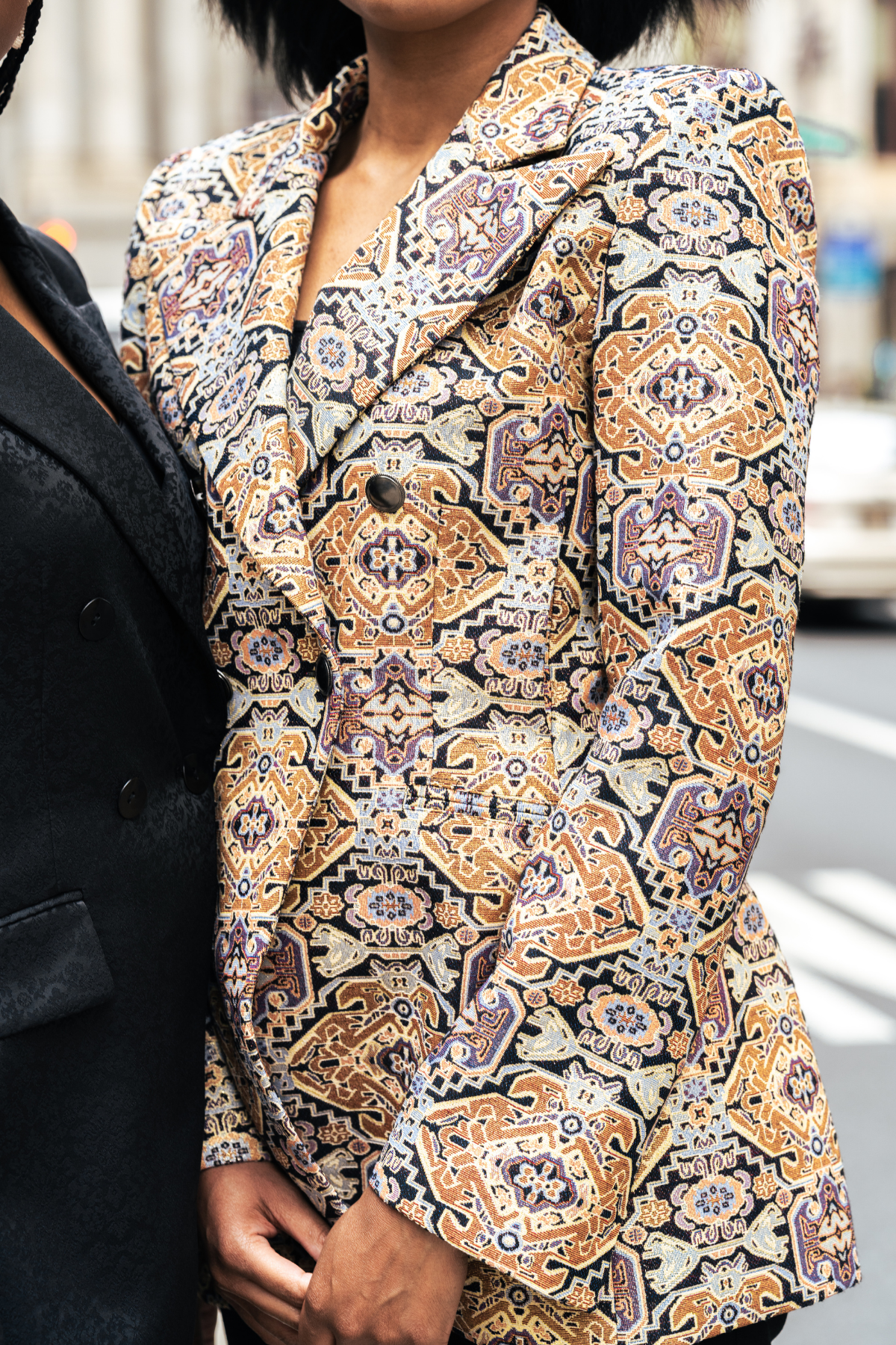 Patterned blazer worn by a person outdoors